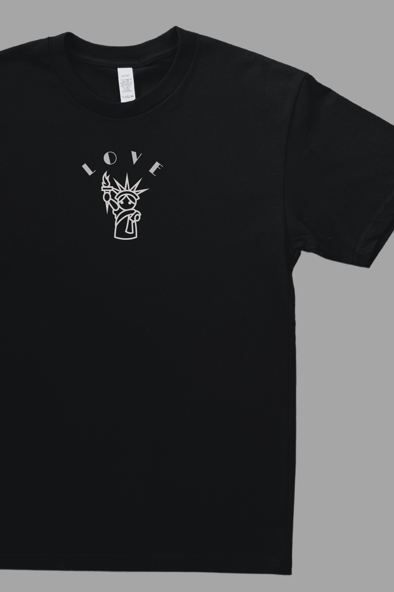 Close-up of Love is Free Liberty design on youth tee - Statue of Liberty print