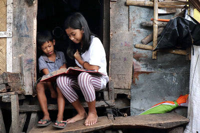 INSPIRRE founder with Children International sponsored children Children International partnership announcement - INSPIRRE giving back INSPIRRE brand story - child sponsorship and social impact