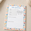 Floral notebook with 'Book Reflection' page on a beige surface