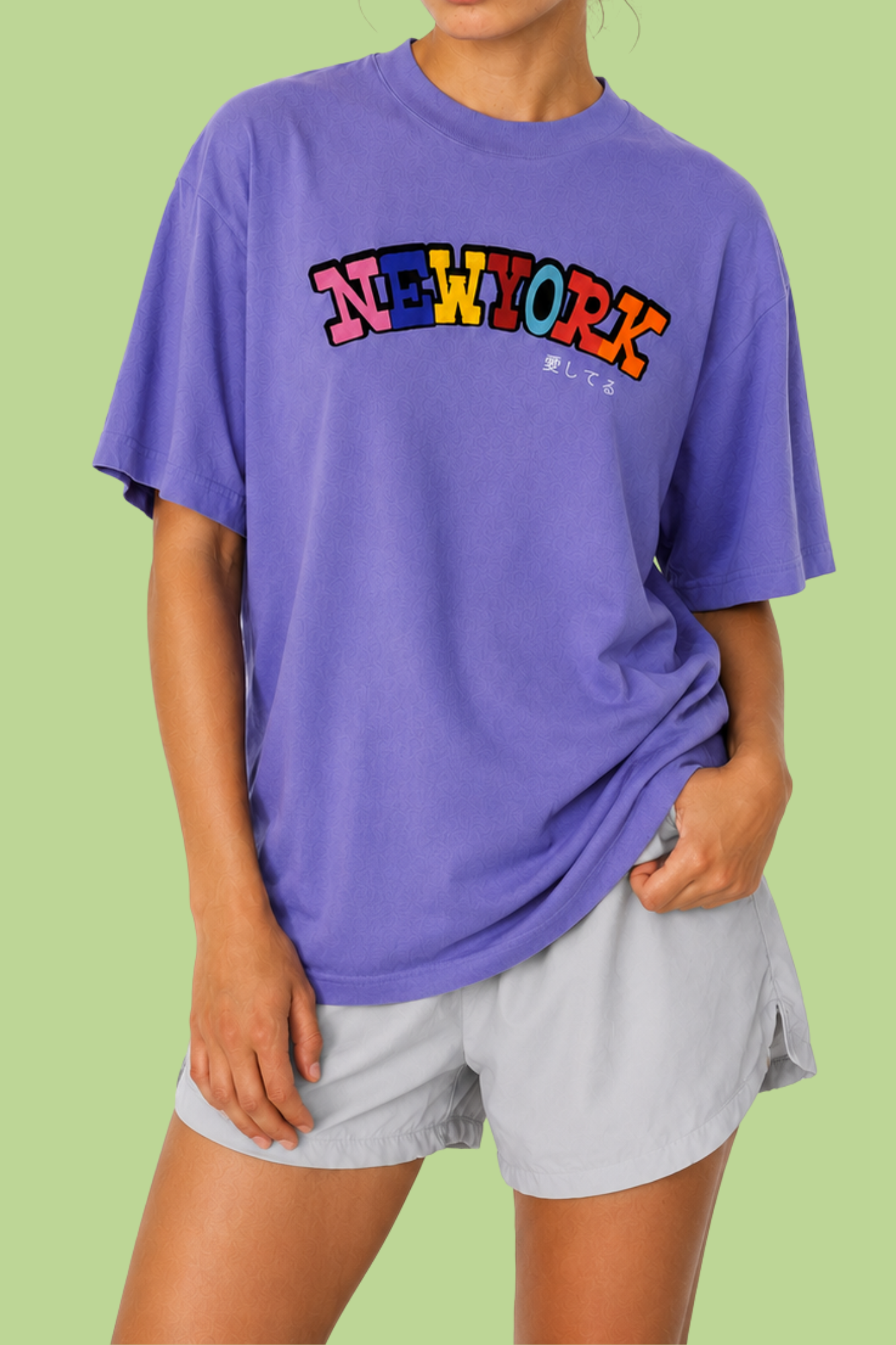 Person wearing a purple new york t-shirt with japanese text I love you
