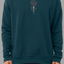 a man wearing a teal sweatshirt with gray rose graphic and japanese text IKIGAI