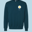 teal sweatshirt with a white daisy graphic and text pursuit ikigai